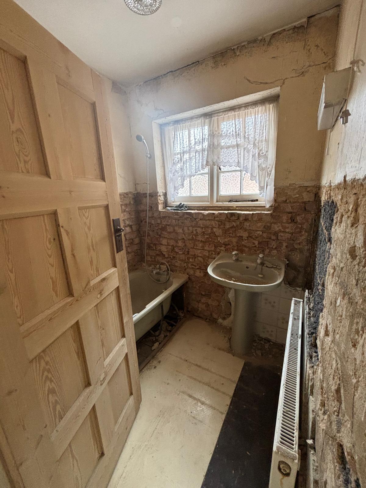 Bathroom stripped back before refurbishment by Propfix